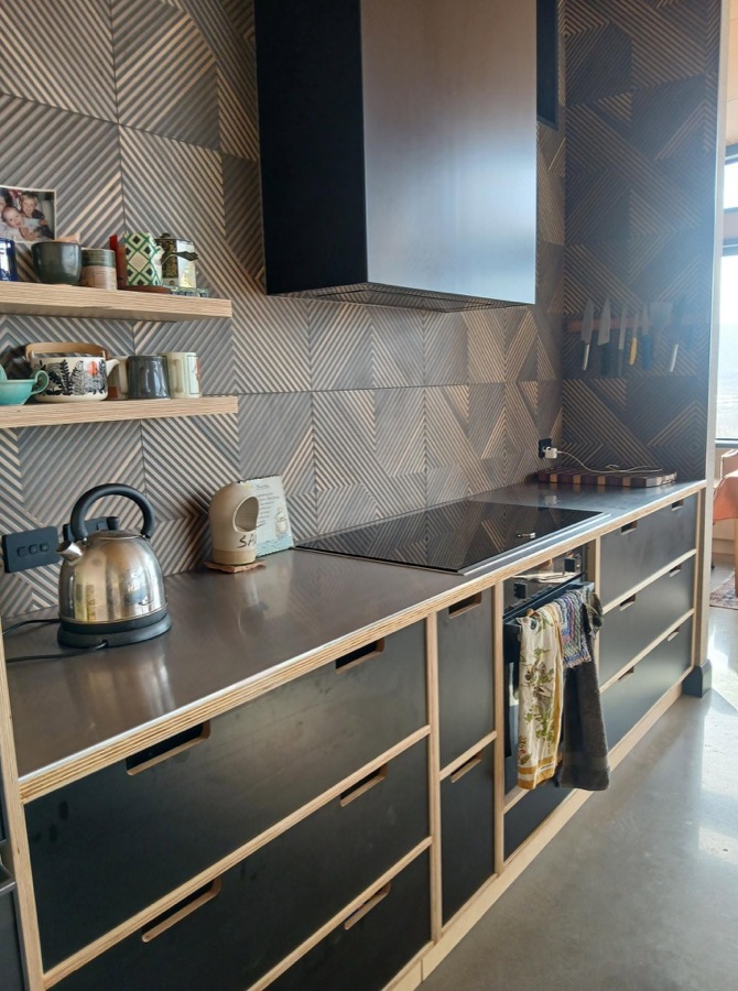Custom joinery and cabinetry with a patterned splashback