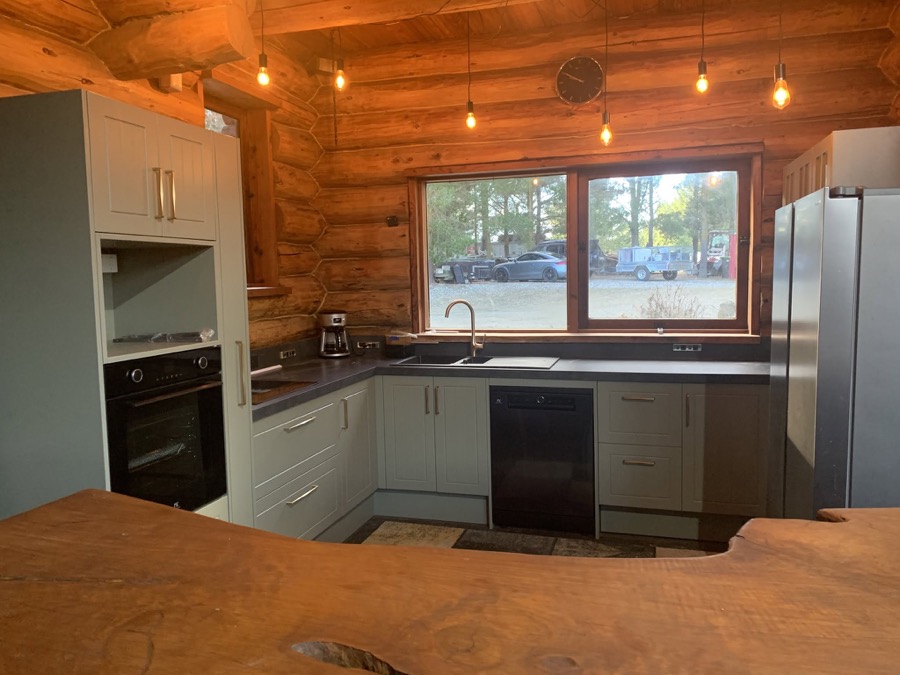 Kitchen with stone benchtop and a mountain view